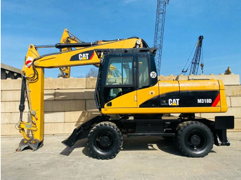Колёсный экскаватор CATERPILLAR M318D