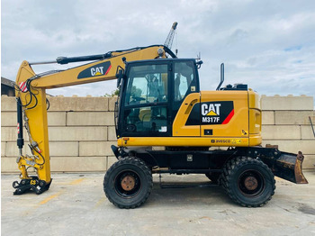 Колёсный экскаватор CATERPILLAR