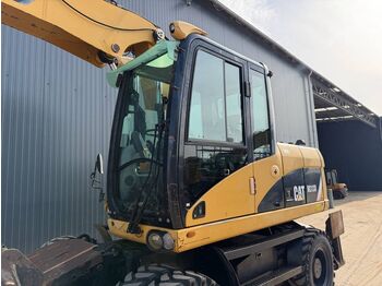 Колёсный экскаватор CATERPILLAR M313D