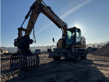 Колёсный экскаватор CATERPILLAR M314