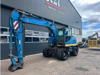Колёсный экскаватор NEW HOLLAND
