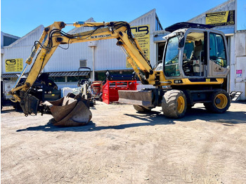 Колёсный экскаватор NEW HOLLAND