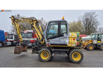 Колёсный экскаватор NEW HOLLAND