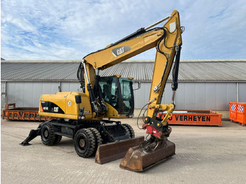 Колёсный экскаватор CATERPILLAR M318D