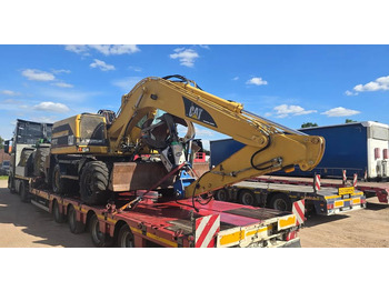 Колёсный экскаватор CATERPILLAR M312