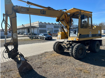 Колёсный экскаватор CATERPILLAR