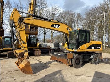Колёсный экскаватор CATERPILLAR M318D