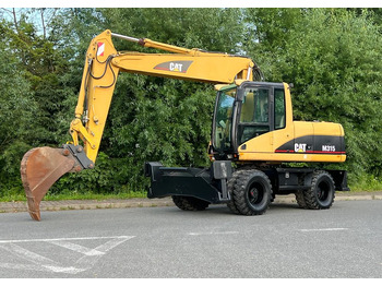 Колёсный экскаватор CATERPILLAR M315C