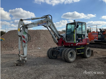 Колёсный экскаватор TAKEUCHI