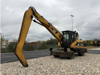 Колёсный экскаватор CATERPILLAR M318