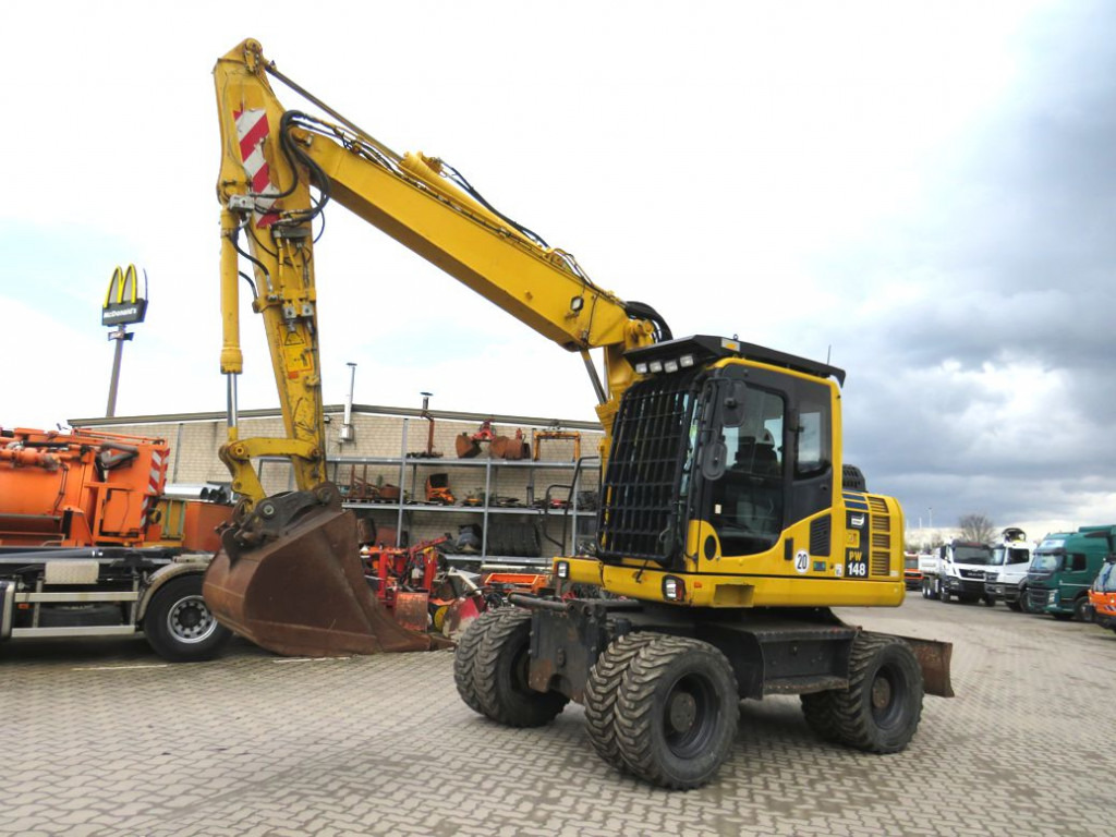 KOMATSU HANOMAG Mobilbagger PW 148 - 8 Bagger 6.824h Deutsch top - Колёсный экскаватор: фото 1 KOMATSU HANOMAG Mobilbagger PW 148 - 8 Bagger 6.824h Deutsch top - Колёсный экскаватор: фото 1