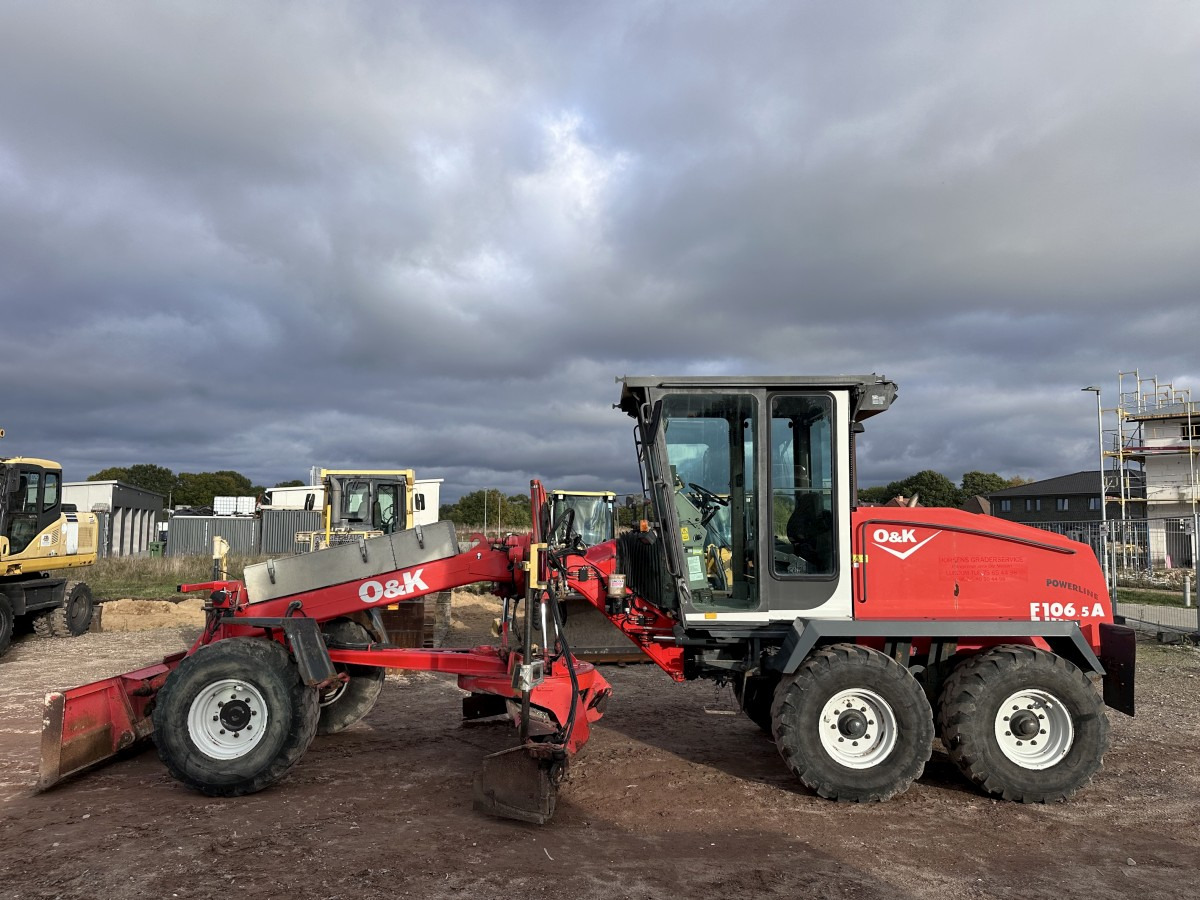 O&K F 106.5 - 6x6 Laser Topcon- Klima Cummins 6 Zyl. - Грейдер: фото 1 O&K F 106.5 - 6x6 Laser Topcon- Klima Cummins 6 Zyl. - Грейдер: фото 1