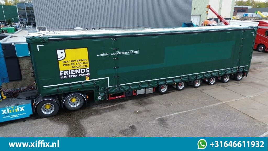 Meusburger 6-ass. Semi dieplader met elektische huifopbouw / 3x naloop gestuurd - Низкорамный полуприцеп: фото 1 Meusburger 6-ass. Semi dieplader met elektische huifopbouw / 3x naloop gestuurd - Низкорамный полуприцеп: фото 1