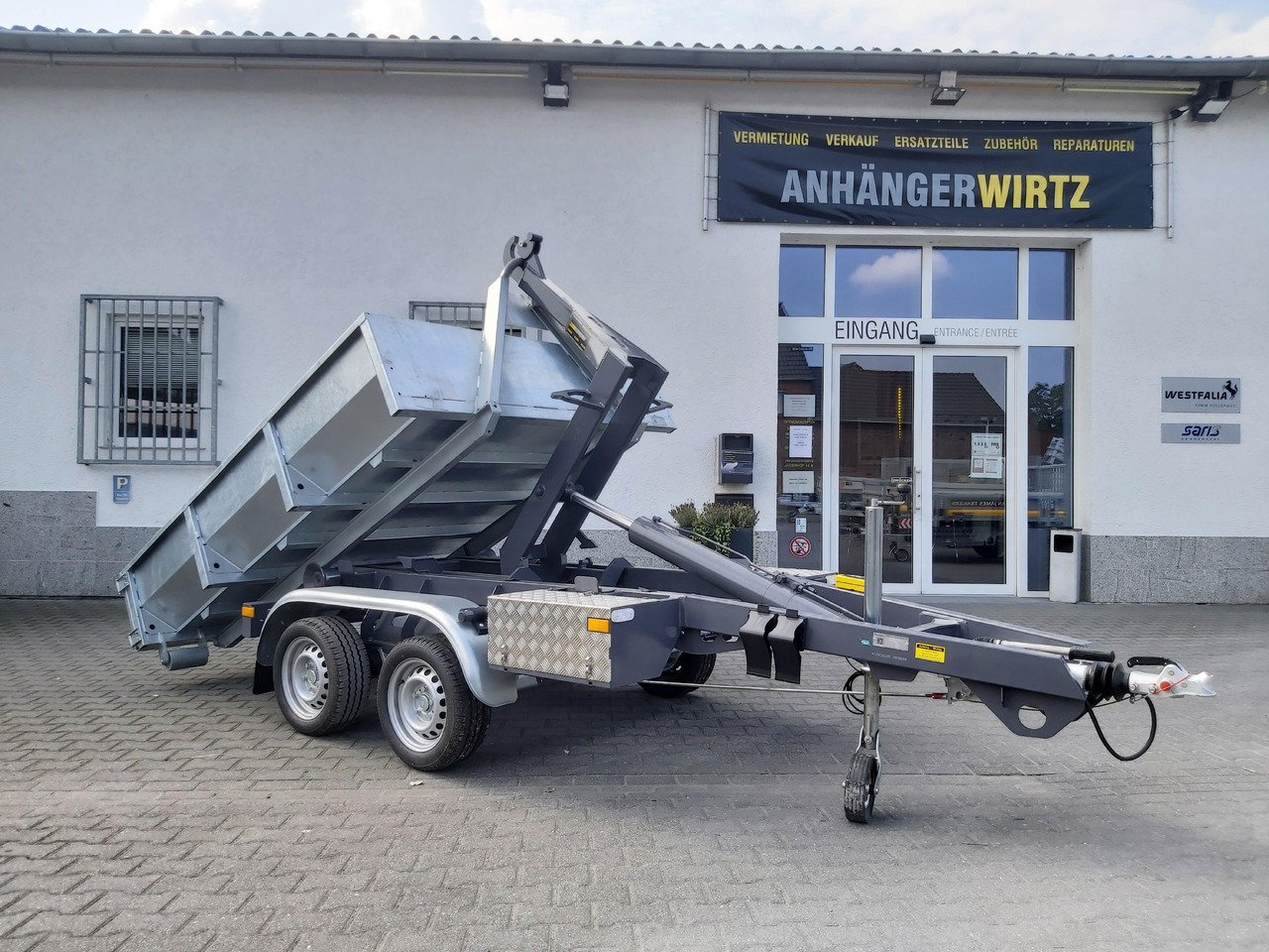 Hakenlift Anhänger Kipper KONOS 3500 elektro hydraulisch 3500kg mit Container Mulde - Самосвальный прицеп: фото 1 Hakenlift Anhänger Kipper KONOS 3500 elektro hydraulisch 3500kg mit Container Mulde - Самосвальный прицеп: фото 1