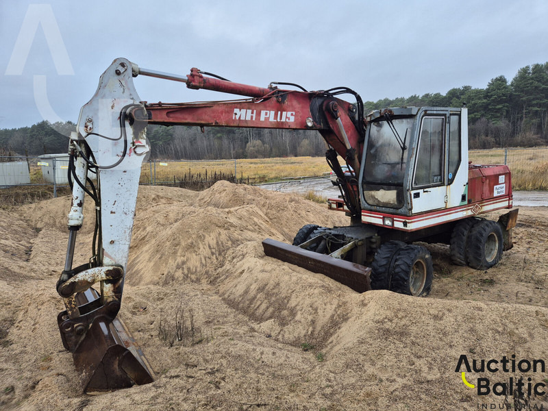 O & K MH4PLUS - Колёсный экскаватор: фото 1 O & K MH4PLUS - Колёсный экскаватор: фото 1