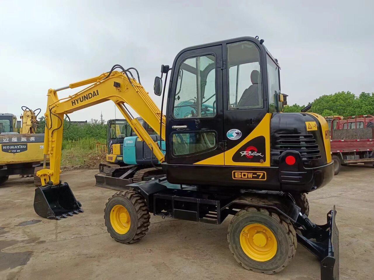 HYUNDAI 60W-7 - Колёсный экскаватор: фото 1 HYUNDAI 60W-7 - Колёсный экскаватор: фото 1
