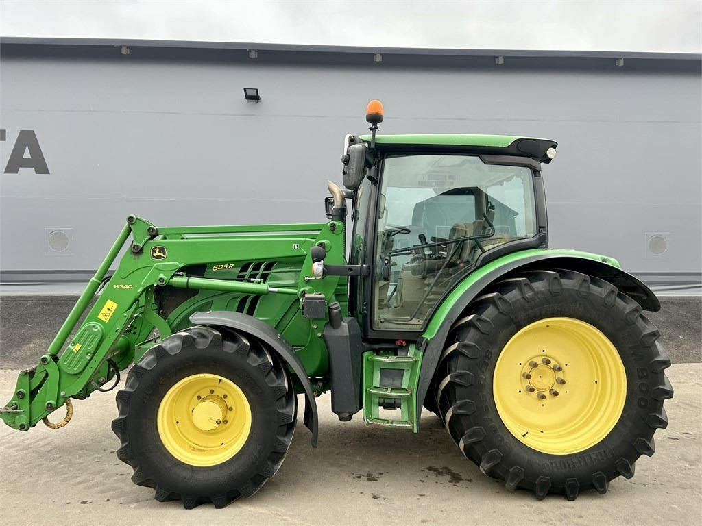 John Deere 6125 R AUTOPOWER ETUKUORMAAJALLA - Трактор: фото 1 John Deere 6125 R AUTOPOWER ETUKUORMAAJALLA - Трактор: фото 1