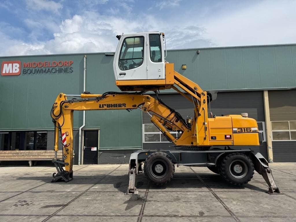 Liebherr A 316 - Перегружатель: фото 1 Liebherr A 316 - Перегружатель: фото 1
