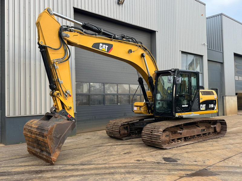 Caterpillar 319DL - Гусеничный экскаватор: фото 2 Caterpillar 319DL - Гусеничный экскаватор: фото 2