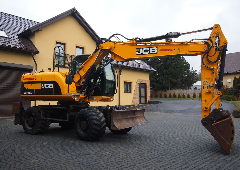 Koparka kołowa JCB JS145W 2011 Koparka JCB - Колёсный экскаватор: фото 1 Koparka kołowa JCB JS145W 2011 Koparka JCB - Колёсный экскаватор: фото 1