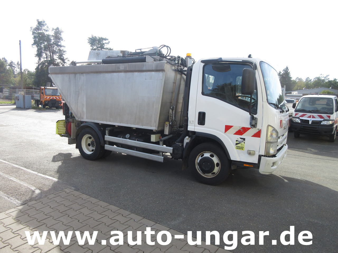 Isuzu NPR 75 Müllwagen Provence Benne - Faun Lifter Presse Kipper Trittbrett Bj 12 - Мусоровоз: фото 1 Isuzu NPR 75 Müllwagen Provence Benne - Faun Lifter Presse Kipper Trittbrett Bj 12 - Мусоровоз: фото 1