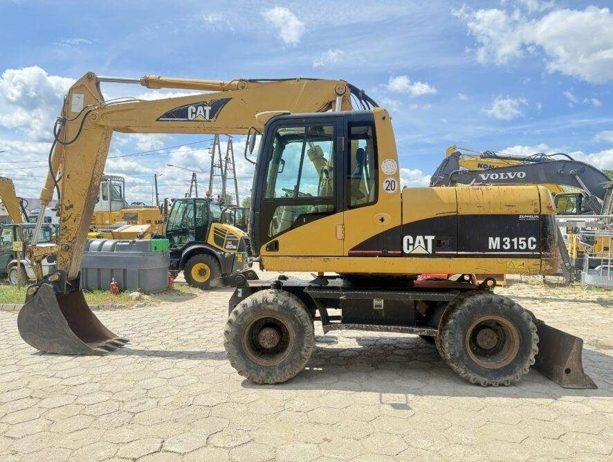 CAT M315C AC - Колёсный экскаватор: фото 1 CAT M315C AC - Колёсный экскаватор: фото 1