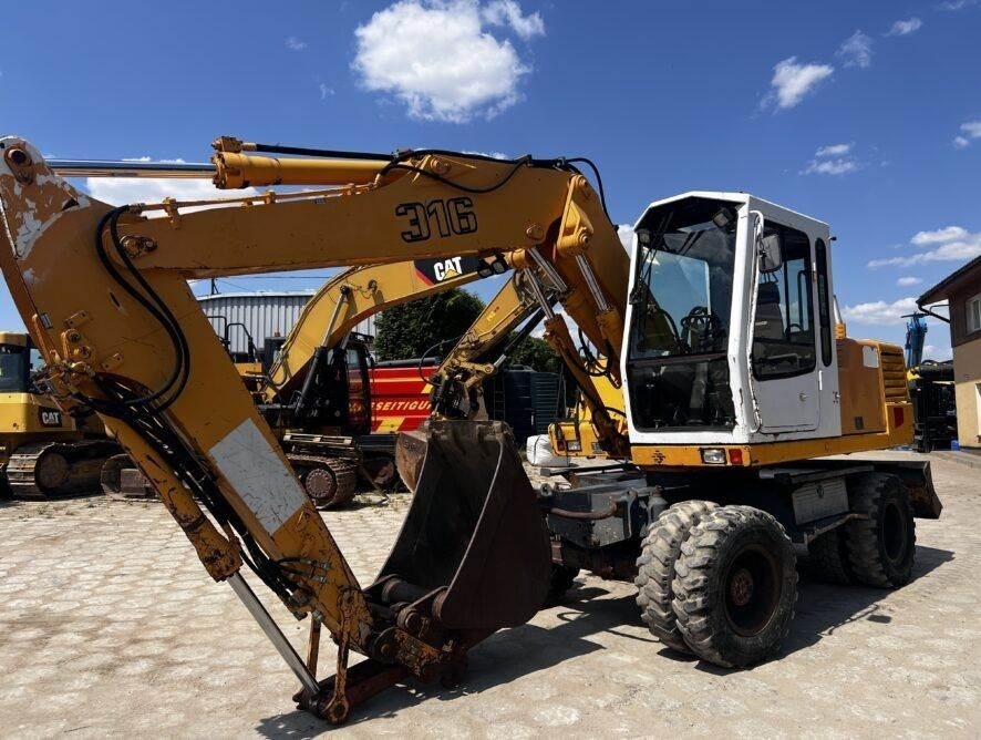 Liebherr A316 - Колёсный экскаватор: фото 1 Liebherr A316 - Колёсный экскаватор: фото 1
