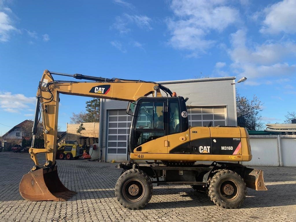 CAT M 316 D - Колёсный экскаватор: фото 2 CAT M 316 D - Колёсный экскаватор: фото 2