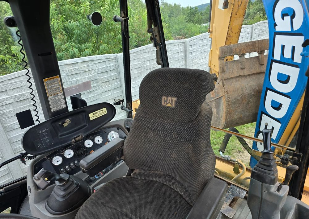 Caterpillar - Экскаватор-погрузчик: фото 3 Caterpillar - Экскаватор-погрузчик: фото 3