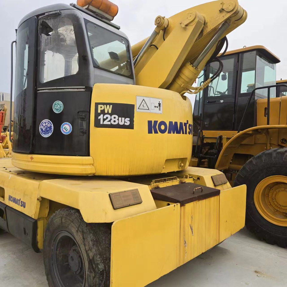 KOMATSU PC128US - Колёсный экскаватор: фото 4 KOMATSU PC128US - Колёсный экскаватор: фото 4