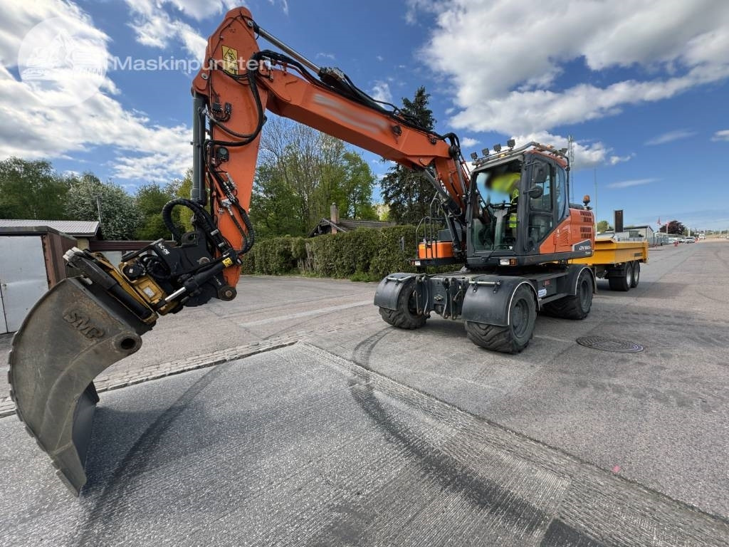 Doosan DX 160 W - Колёсный экскаватор: фото 1 Doosan DX 160 W - Колёсный экскаватор: фото 1