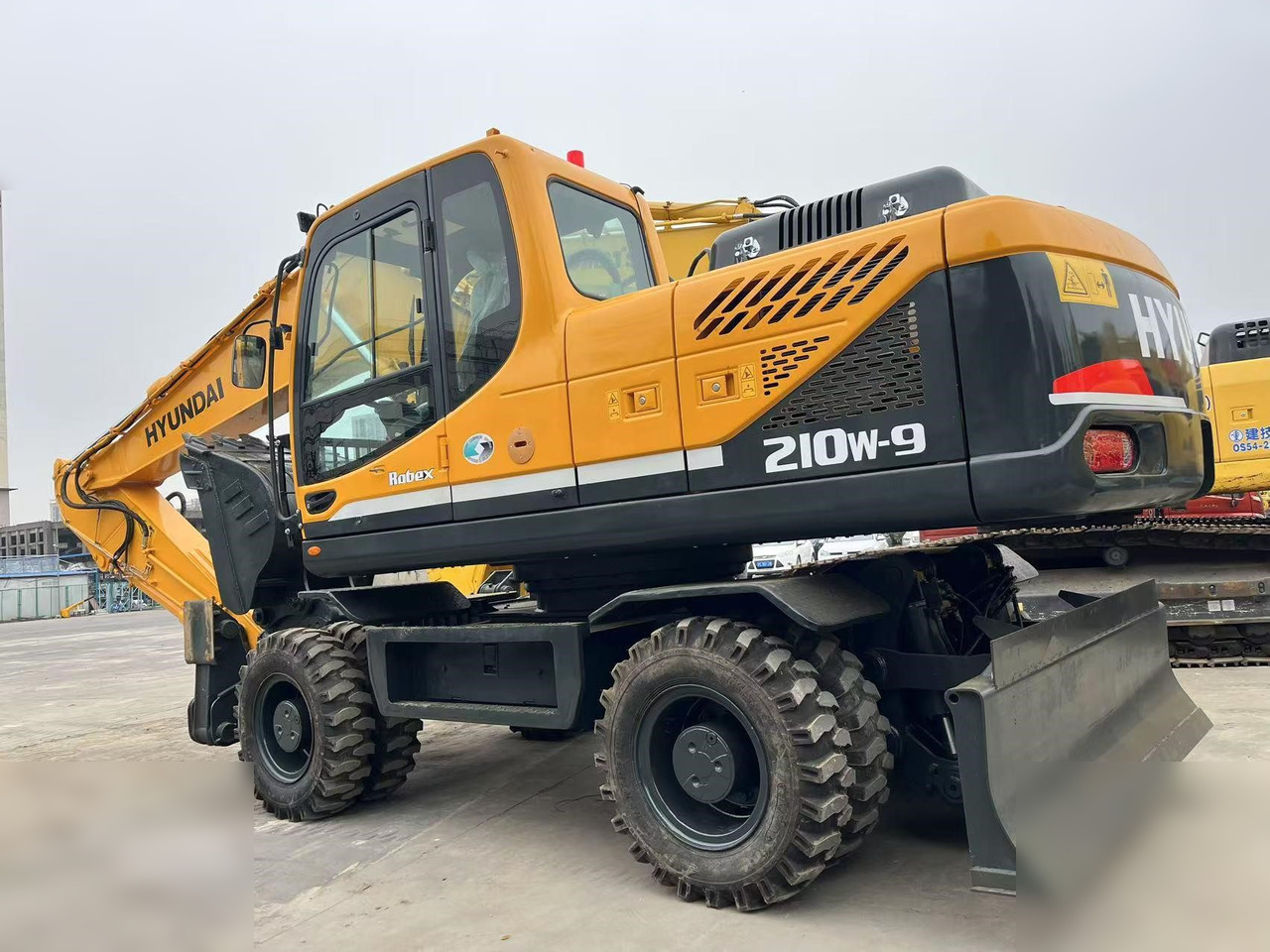 HYUNDAI ROBEX 210W-9S - Колёсный экскаватор: фото 1 HYUNDAI ROBEX 210W-9S - Колёсный экскаватор: фото 1