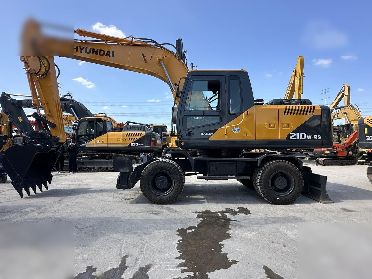 HYUNDAI ROBEX 210W-9S - Колёсный экскаватор: фото 1 HYUNDAI ROBEX 210W-9S - Колёсный экскаватор: фото 1