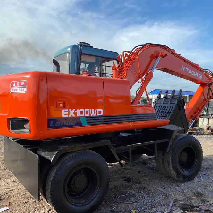 Used Hitachi Ex100WD Wheel Excavator for Sale Japan Made Hitachi Ex100wd Wheeled Excavator for Sale - Гусеничный экскаватор: фото 1 Used Hitachi Ex100WD Wheel Excavator for Sale Japan Made Hitachi Ex100wd Wheeled Excavator for Sale - Гусеничный экскаватор: фото 1