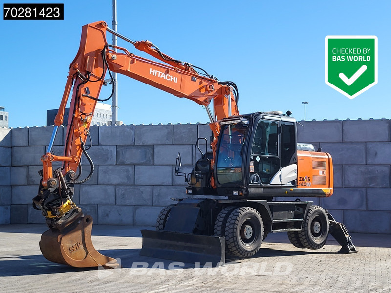 Hitachi ZX140W -5 OUTRIGGERS + BLADE - Колёсный экскаватор: фото 1 Hitachi ZX140W -5 OUTRIGGERS + BLADE - Колёсный экскаватор: фото 1