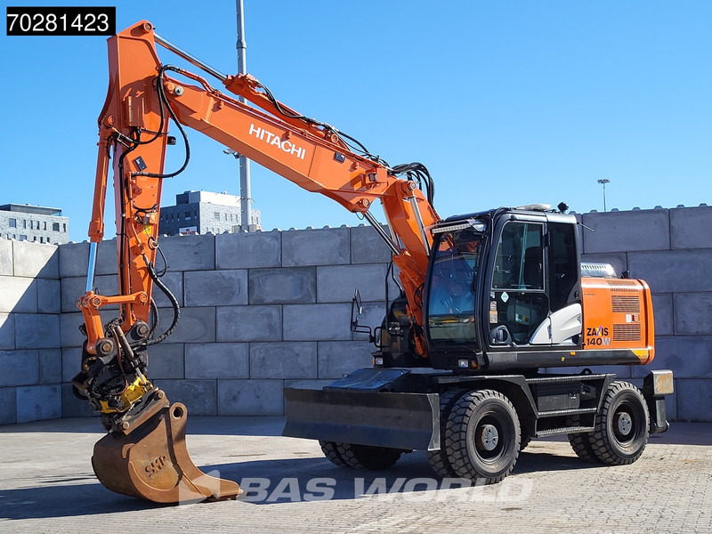 Hitachi ZX140W -5 OUTRIGGERS + BLADE - Колёсный экскаватор: фото 2 Hitachi ZX140W -5 OUTRIGGERS + BLADE - Колёсный экскаватор: фото 2