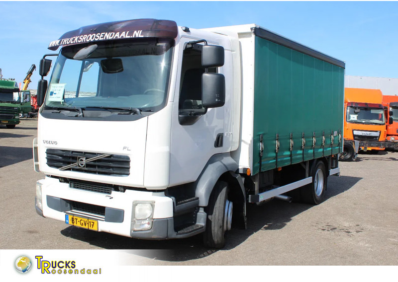 Volvo FL 12 .240 + LIFT + MANUAL - Тентованный грузовик: фото 1 Volvo FL 12 .240 + LIFT + MANUAL - Тентованный грузовик: фото 1