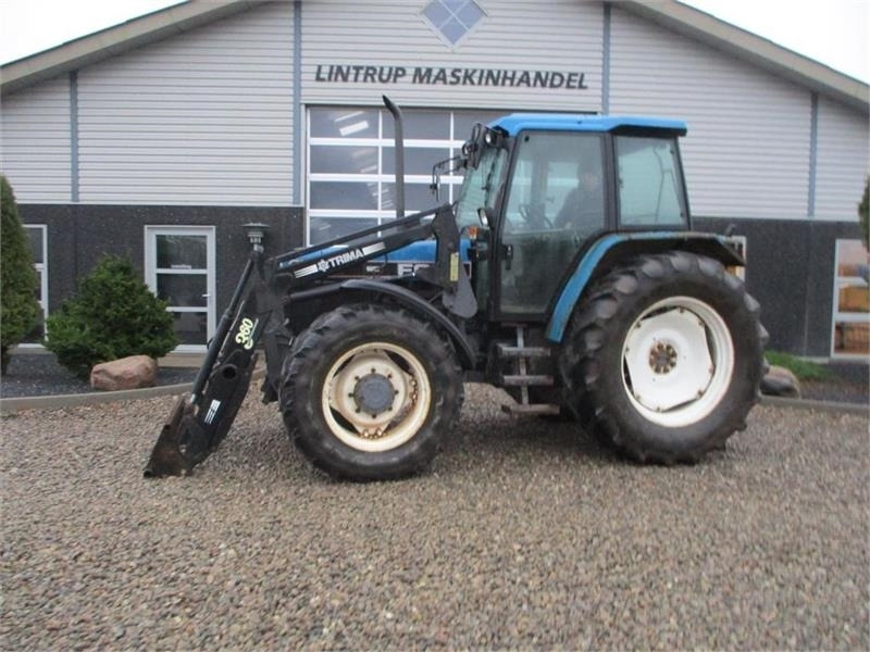 New Holland 7740 SLE Turbo Med frontlæsser og frontlift. - Трактор: фото 1 New Holland 7740 SLE Turbo Med frontlæsser og frontlift. - Трактор: фото 1