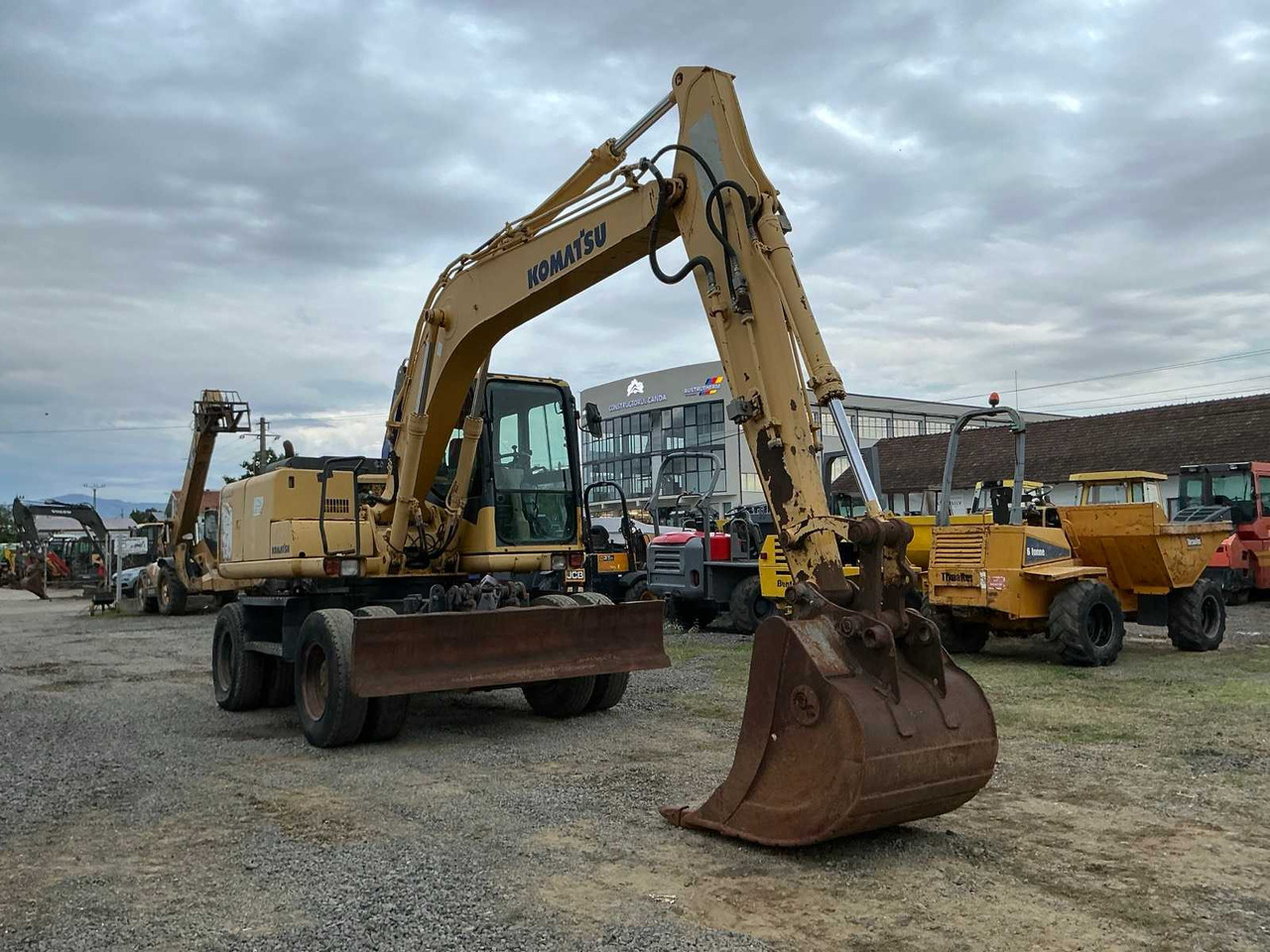Komatsu PW 130 -7K - Колёсный экскаватор: фото 1 Komatsu PW 130 -7K - Колёсный экскаватор: фото 1