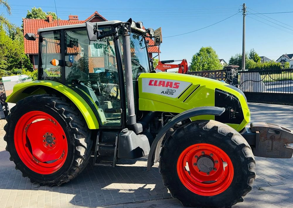 Claas Axos 330 - Трактор: фото 1 Claas Axos 330 - Трактор: фото 1