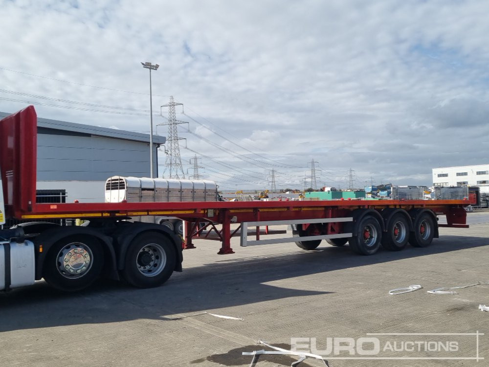 2010 Dennison Tri-Axle - Полуприцеп бортовой/ Платформа: фото 1 2010 Dennison Tri-Axle - Полуприцеп бортовой/ Платформа: фото 1
