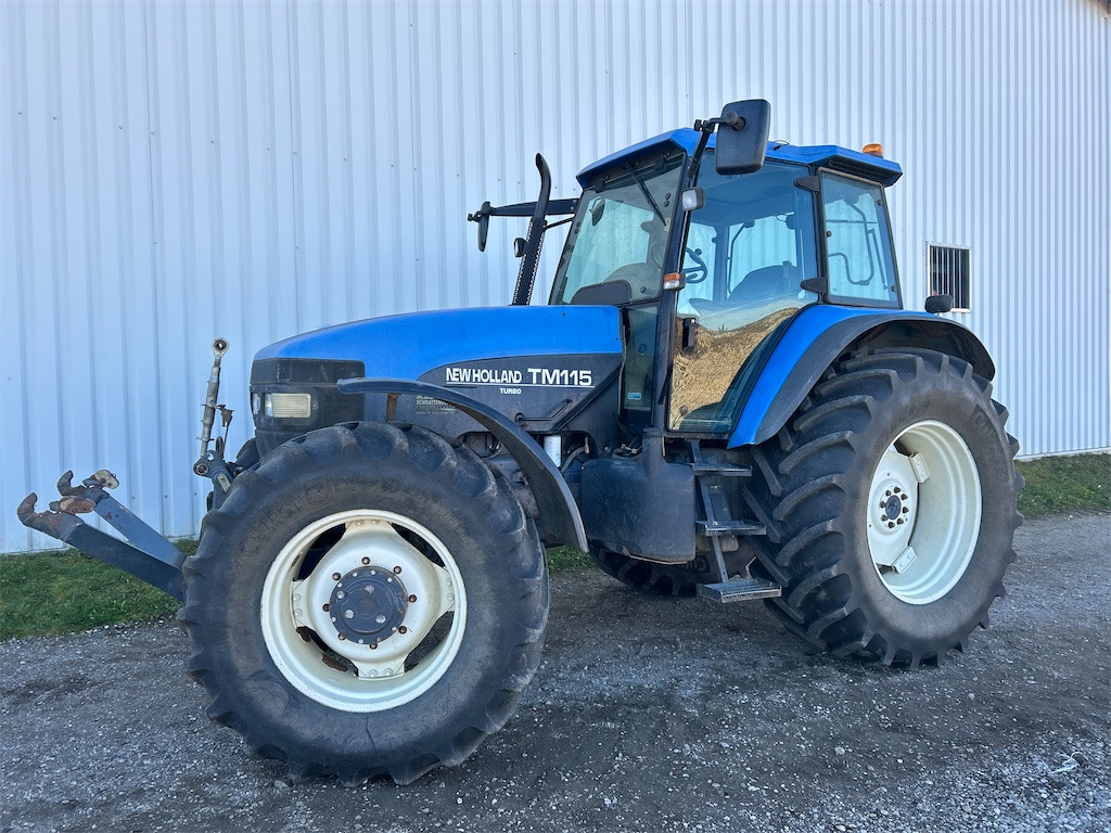 New Holland TM115 (2001) - Трактор: фото 1 New Holland TM115 (2001) - Трактор: фото 1
